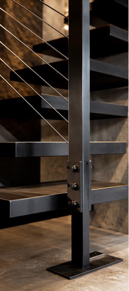 Blackened steel floating stair and custom rail