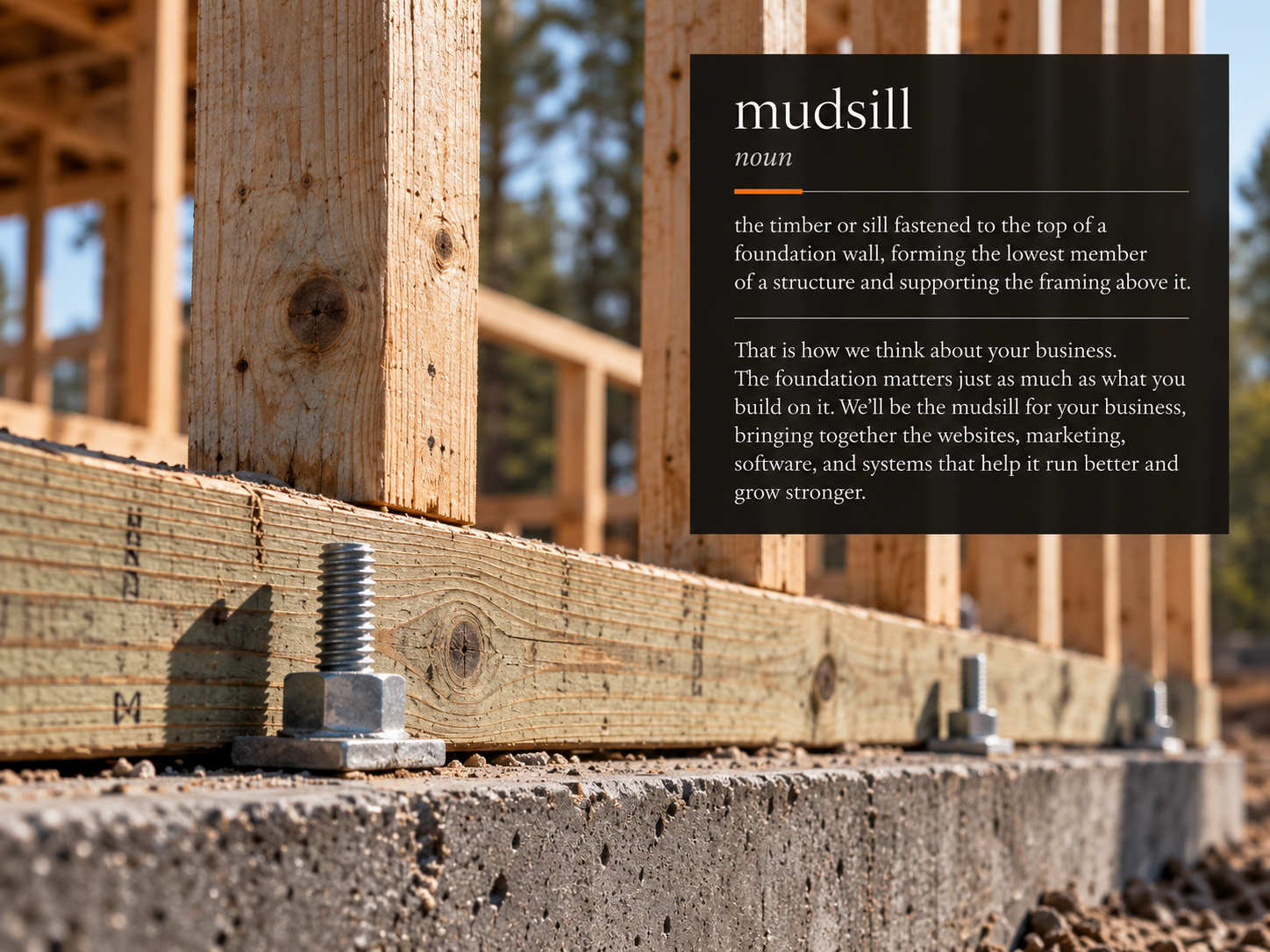 A timber sill anchored to a concrete foundation with the Mudsill definition